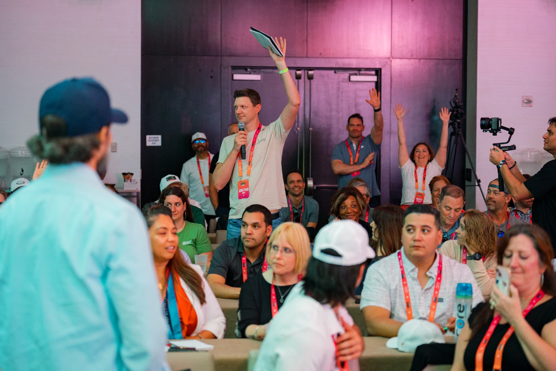An attendee taking the mic during an Immersion session